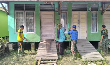 Satgas dan Warga Bergotong Royong Cat 55 Unit Rumah di Lokasi TMMD
